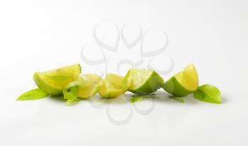 Fresh lime wedges in a row