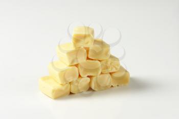 Stack of caramel-like white chewy candies