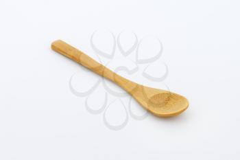 Small flat rustic wooden spoon
