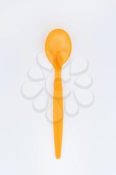 Orange plastic spoon for daily use