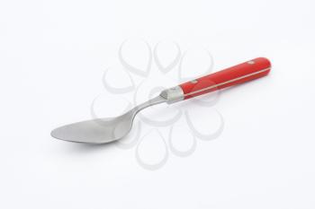 empty spoon with red handle