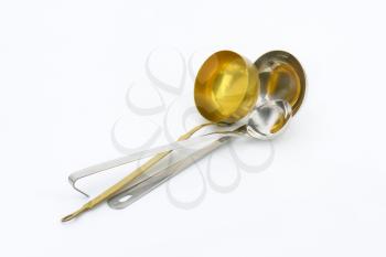 three different ladles - for soup, sauces or gravy