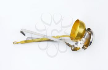 three different ladles - for soup, sauces or gravy