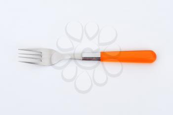 dinner fork with orange plastic handle