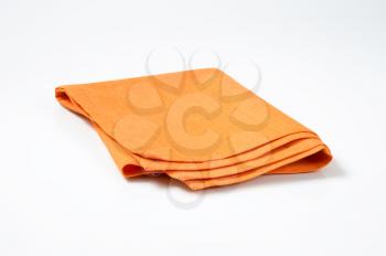 single orange napkin folded twice
