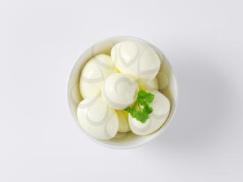 hard boiled eggs in white bowl