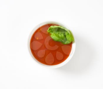 tomato soup in white porcelain bowl