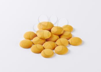 heap of small round sponge biscuits