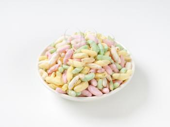 bowl of sugar coated colored puffed rice