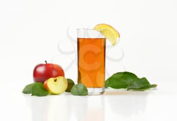 fresh red apples and glass of apple juice