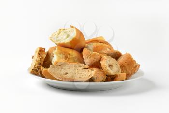 pieces of various types of bread on plate