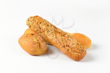 freshly baked bread rolls on white background