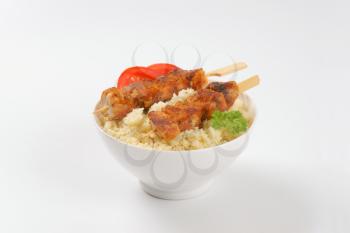 bowl of couscous and spicy chicken souvlaki