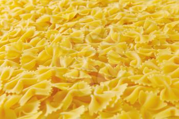Background of uncooked bow tie pasta