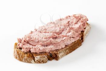 slice of bread with ham spread