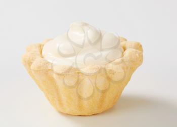 Mini tart shell filled with rich white cream
