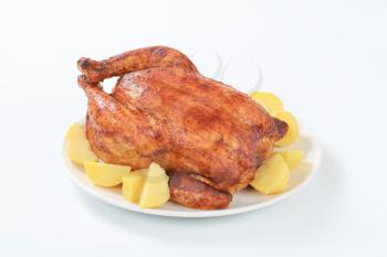 Dish of marinated roasted chicken and boiled potatoes