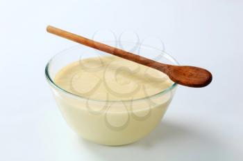 bowl of raw batter and wooden spoon