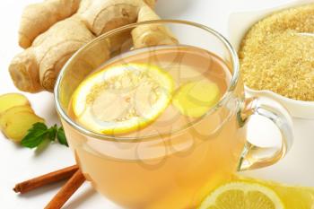 detail of cup of ginger tea with lemon