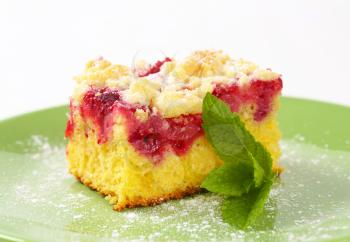 Raspberry crumb cake on green plate