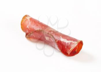 Slice of smoked marinated beef - rolled up