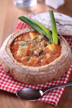 Goulash served in a bread bowl