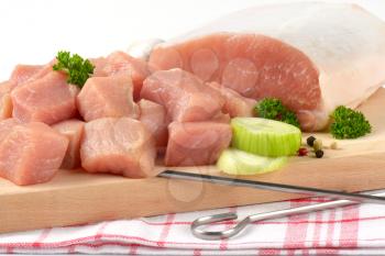 Diced lean raw pork on cutting board