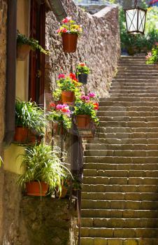 Narrow street in ancient town of Volterra, Tuscany, Italy