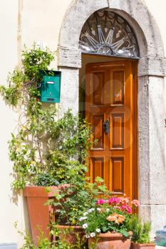 Potted plants at the entrance to a house in the village of Bagni San Filippo, Tuscany, Italy