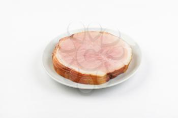 stack of ham slices on white plate