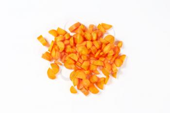 heap of chopped carrot on white background