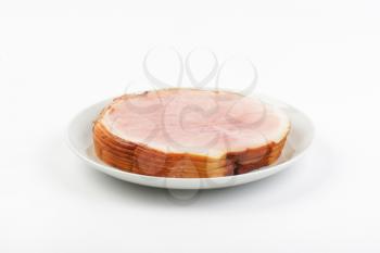stack of ham slices on white plate
