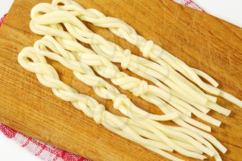 String cheese in the shape of little braids (Korbaciky)