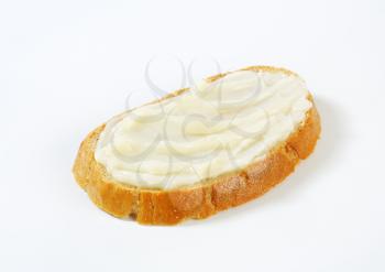 Slice of bread spread with lard
