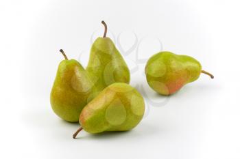 four ripe pears on white background