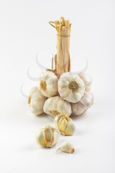 garlic bulbs and cloves on white background