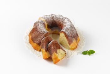 marble bundt cake, two slices cut off
