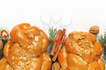 two loaves of sweet braided bread on white background