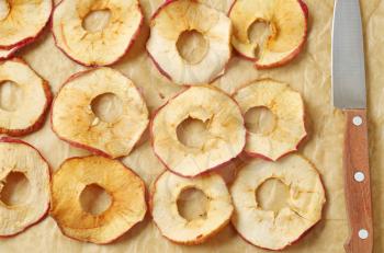Apple chips on baking parchment paper