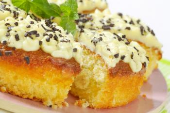 Sponge cake with lemon buttercream frosting on a plate