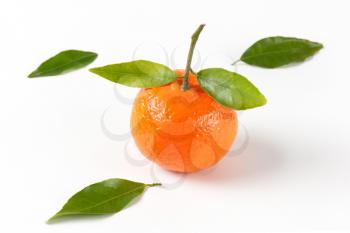 tangerine with leaves on white background