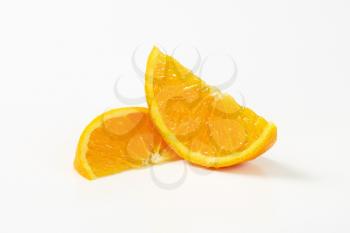 Fresh orange wedges on white background