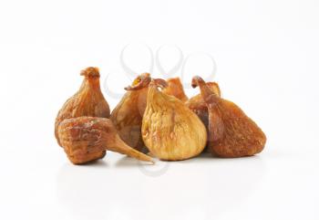 sun dried figs on white background