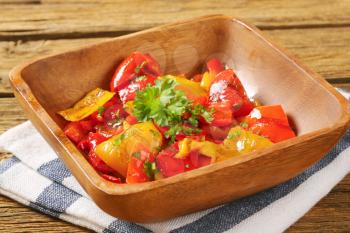 Bowl of roasted sweet peppers marinated in oil