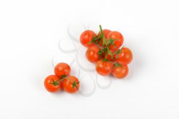 ripe cherry tomatoes on white background