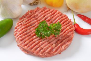 close up of raw hamburger patty