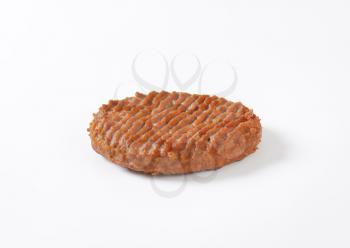 pan fried hamburger patty on white background
