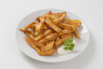 plate of chipped potatoes with mayonnaise