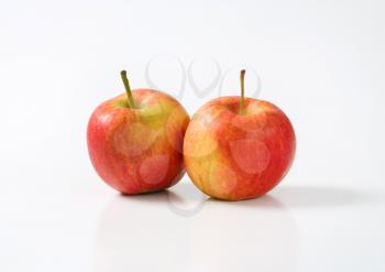 two ripe apples on white background