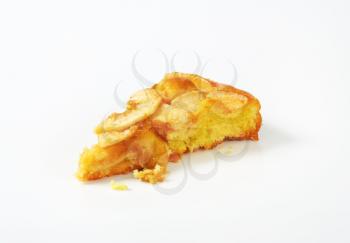 slice of apple sponge cake on white background